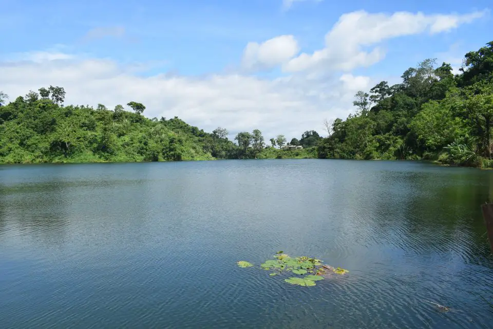 Stunning Boga Lake in Bangladesh to visit. Clear river , green trees and clouds in the sky