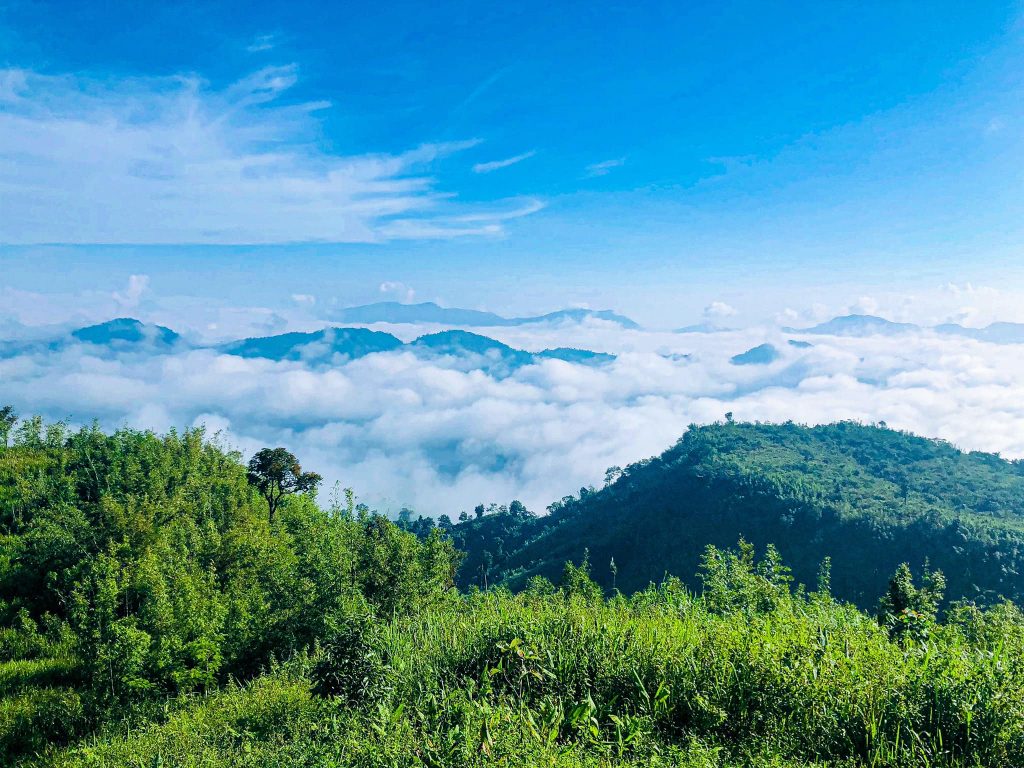 Wonderful sunny day, white cloud in the sky , lots of greeny mountain views from Keokradong, Bangladesh. One of the must visited place in Bangladesh for travelers