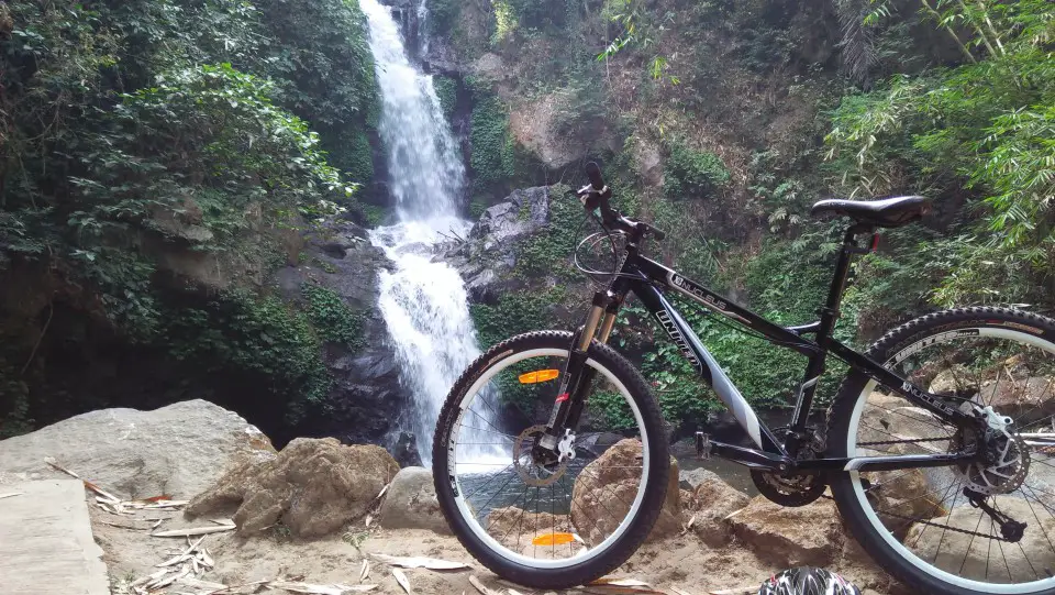 A bicycle in front of Sekar Langit Waterfall