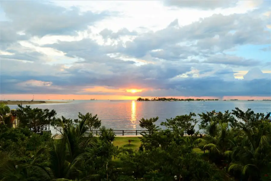 the view of the sunset around the beach of losari Makassar