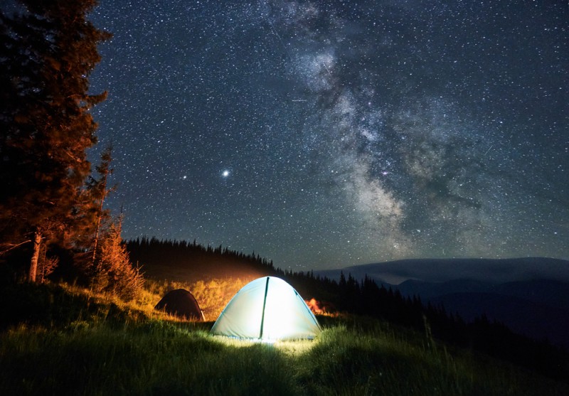 a tent lit up at night