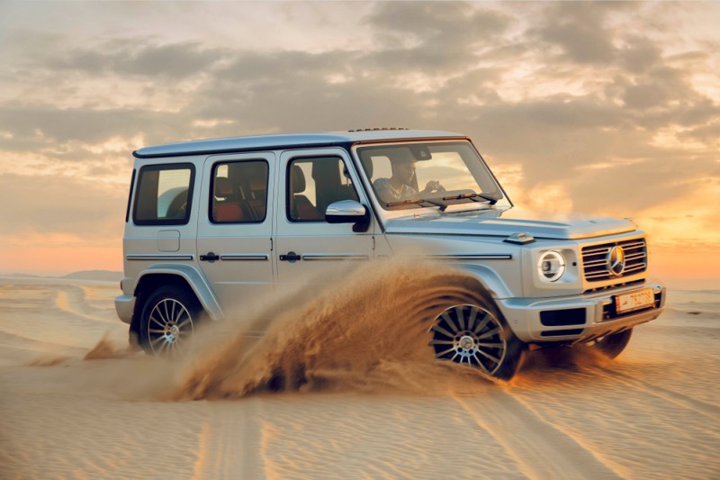 a car driving through sand