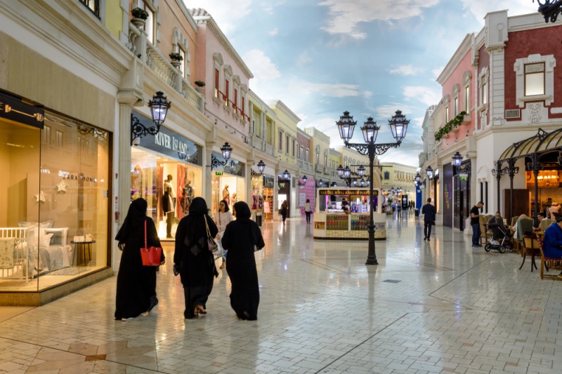 Three women shopping in Abu Dhabi mall, enjoying their time together