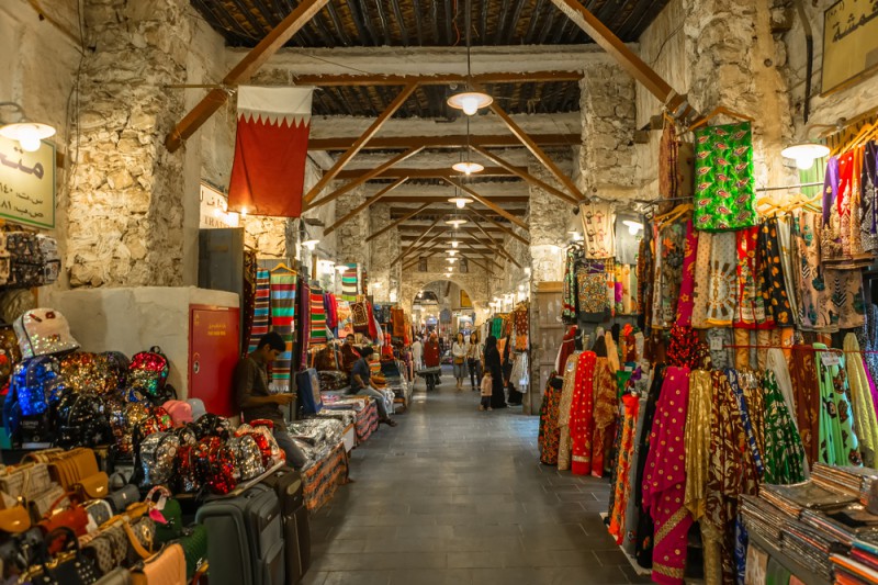a store with persony clothes and bags