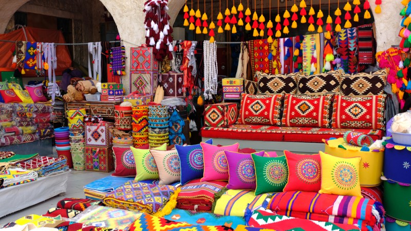 a display of colorful pillows and blankets