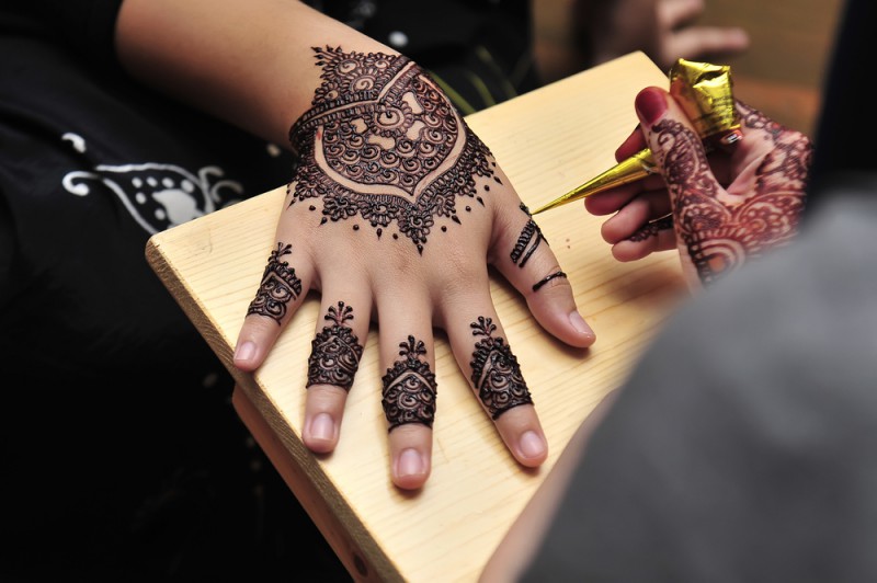 A woman with a henna design on her hand