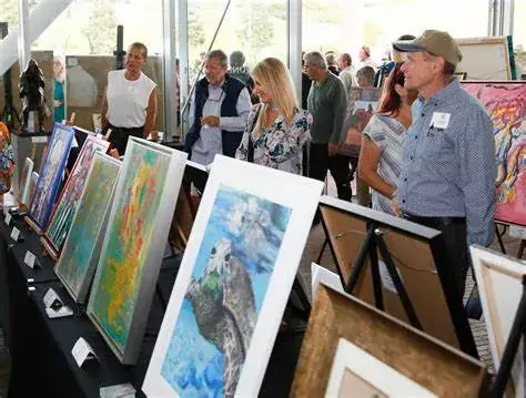A group of people at an art exhibition